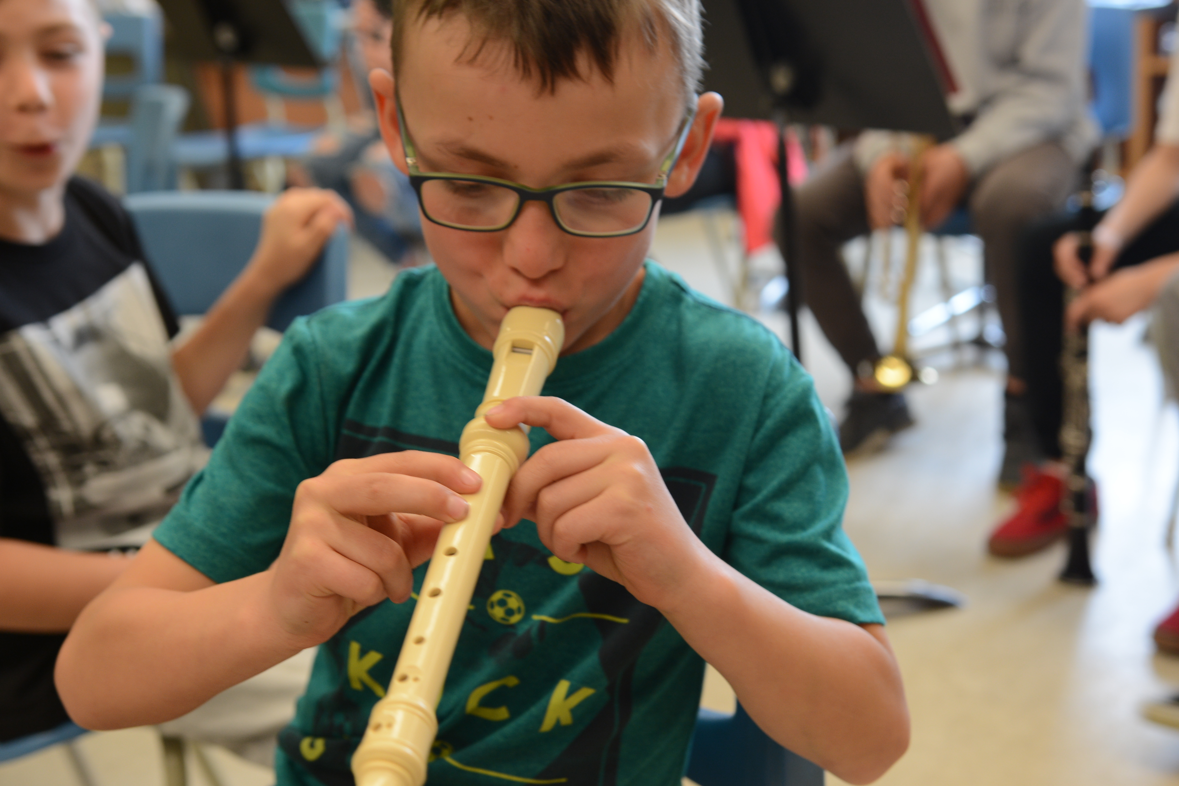 A boy plays the recorder