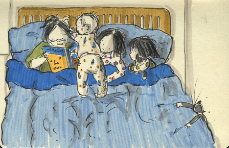 kids in bed wth mom reading bedtime story